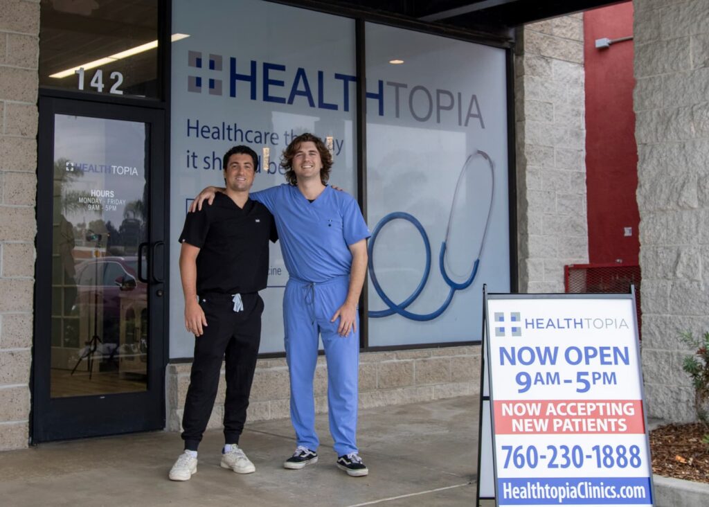 Two of our staff at the entrance of the Healthtopia Encinitas clinic
