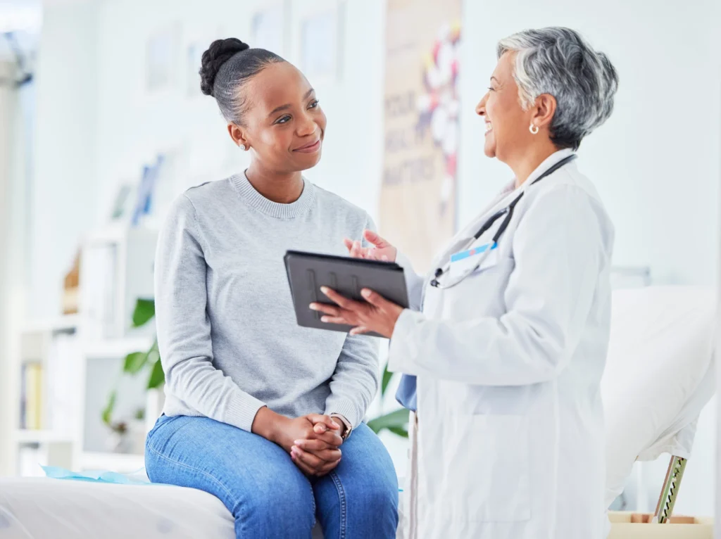 Primary care doctor in San Diego meeting with a new patient.