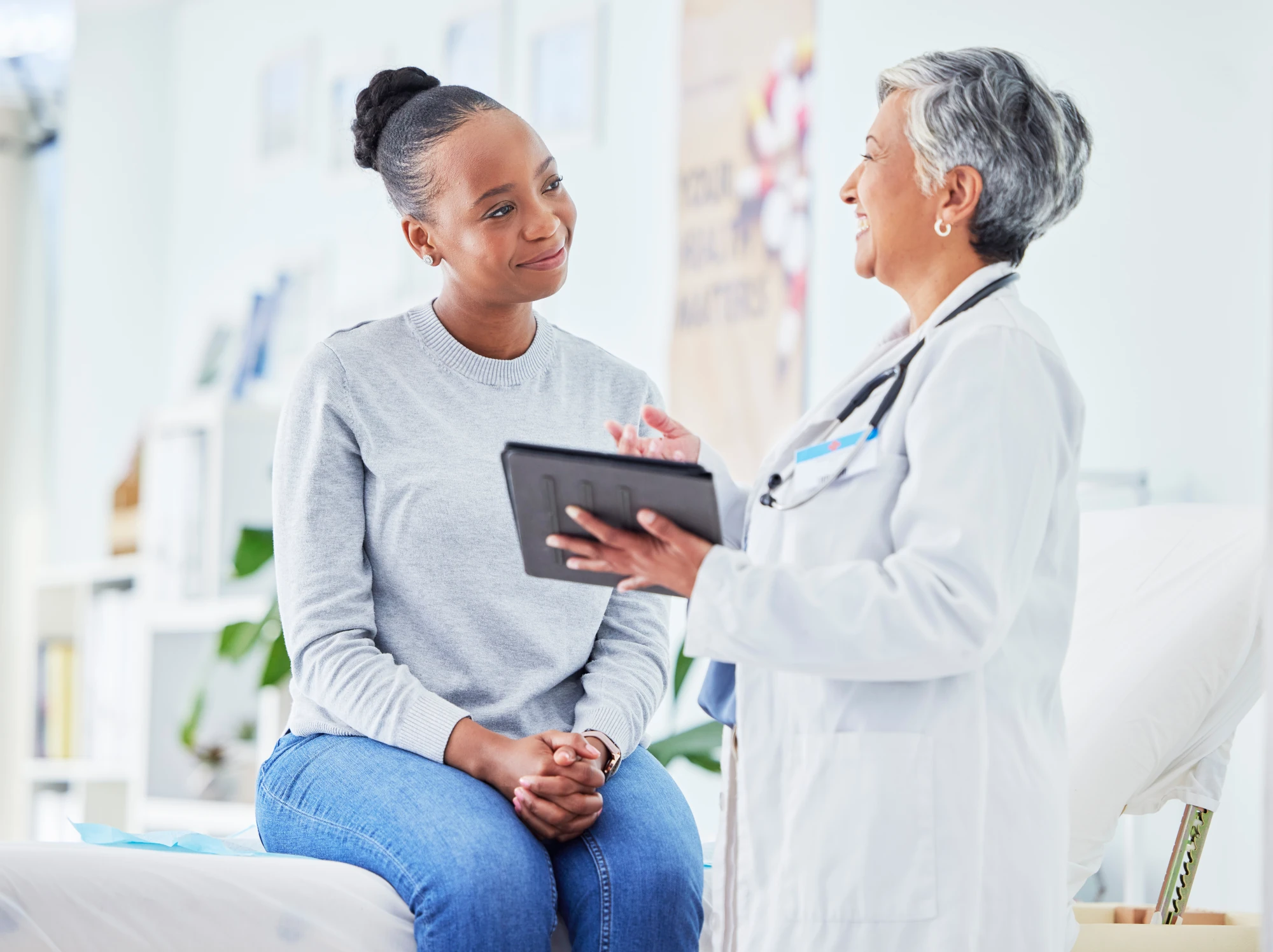 Primary care doctor in San Diego meeting with a new patient.