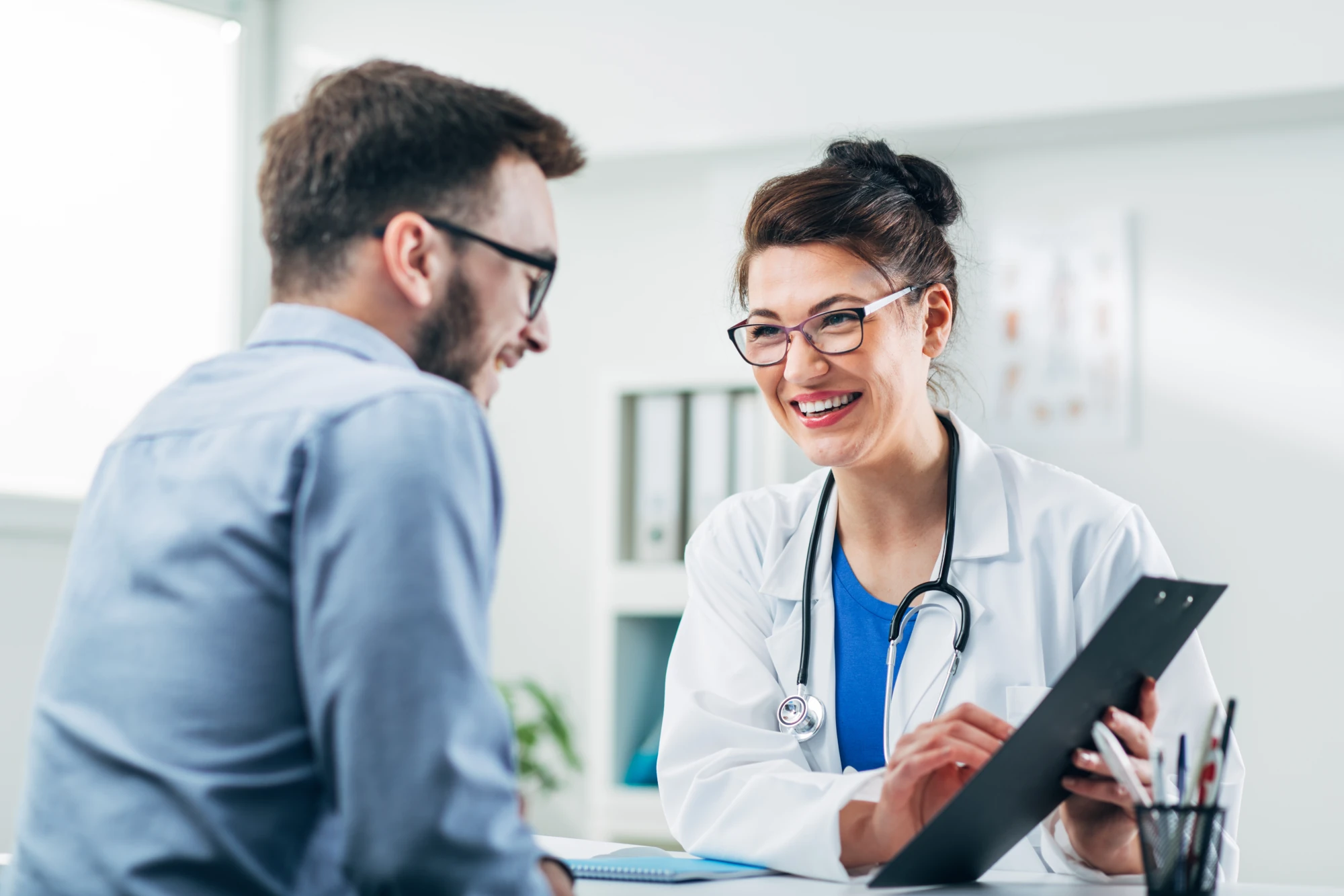 Healthtopia primary care doctor in San Diego reviewing test results with a patient.